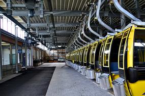 Shiny, yellow car cabins in the building, with light