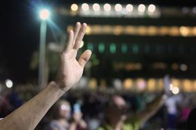 a man's hand in the dark