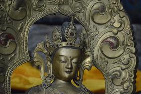 a beautiful Buddhist sculpture in gold.