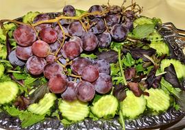 Sliced cucumbers and grapes