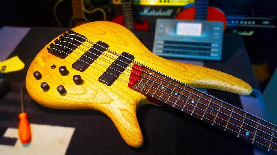 wooden guitar and screwdriver