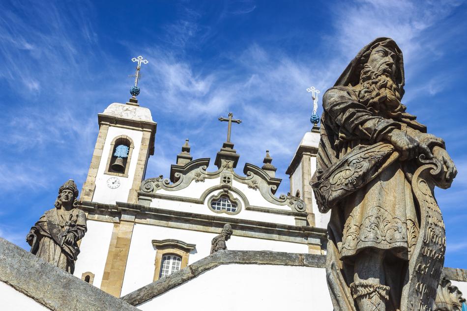 sculpture of a man on the background of a castle