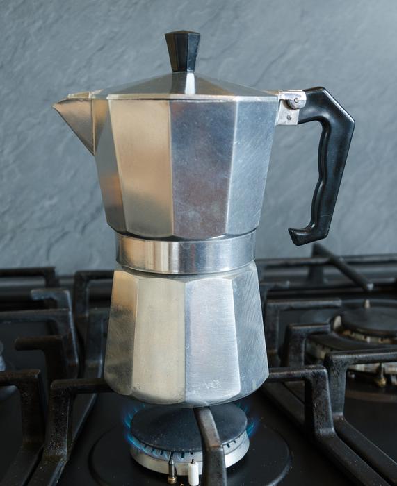 Iron kettle for brewing coffee on the stove