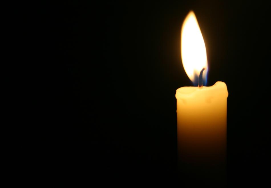 burning candle in the night landscape