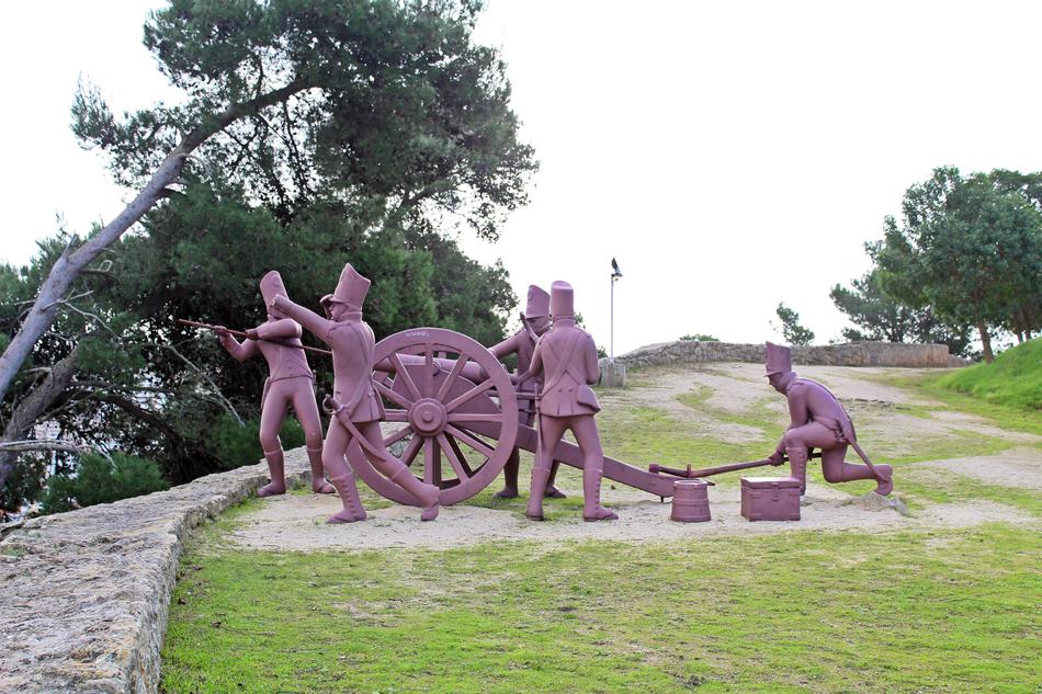 sculpture of people with a wheel