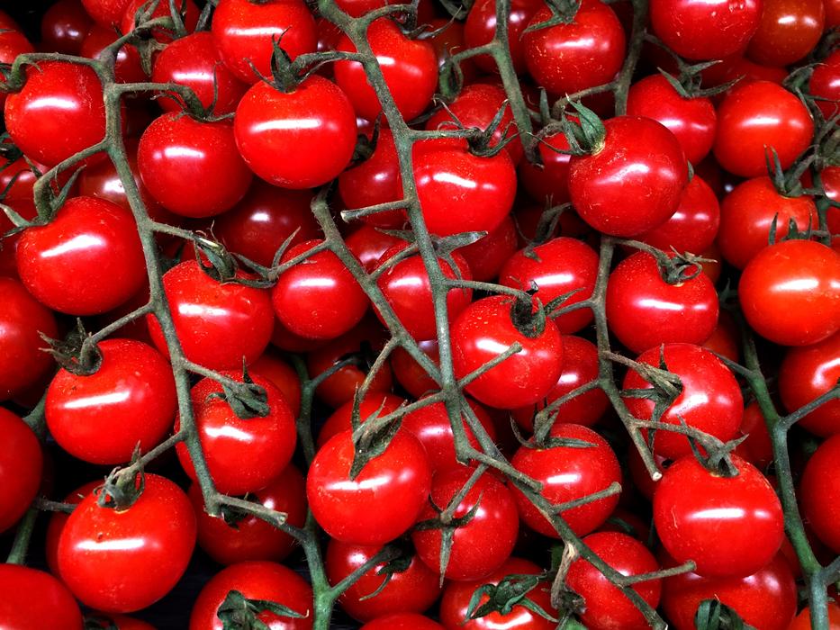 delicious tomatoes in a box at the market