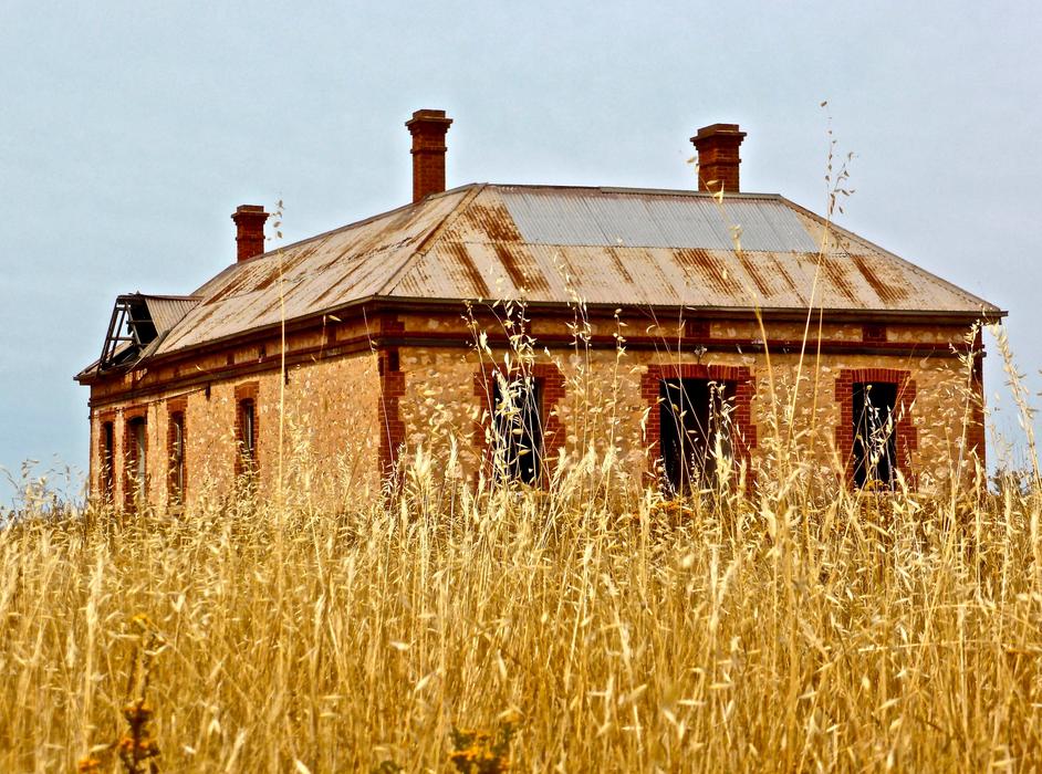 old house in wheat field