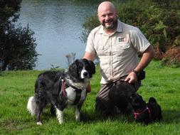 Dog Walker and man in park