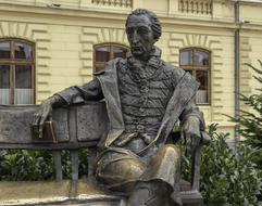 sculpture of a man with a book