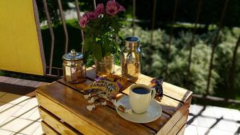 hot coffee and flowers on the table