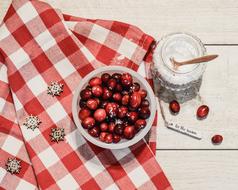 Cranberries with sugar on a colorful table
