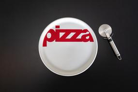 white plate signed pizza