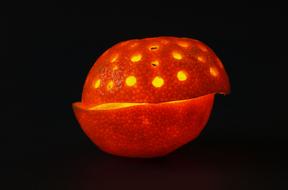 glowing tangerine on a black background