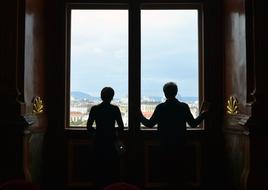 the silhouette of a couple at the window