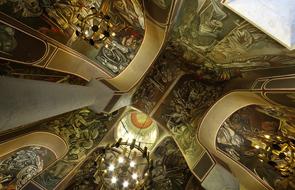 golden ceiling with chandeliers in the temple