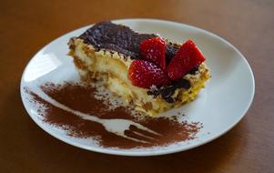 Slice of sweet cake with berries