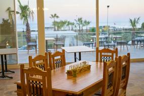 wooden table and chairs at the hotel