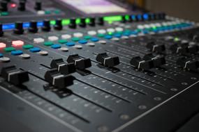 Mixer in a music studio close-up on a blurred background