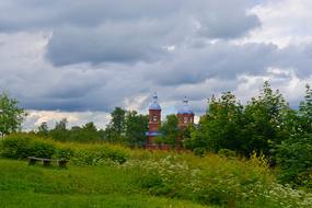 castle in green meadows with trees