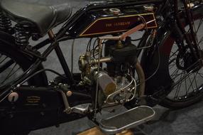 Shiny motorcycle with the single cylinder, in sunbeam