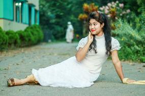 a girl in a white dress with red lipstick