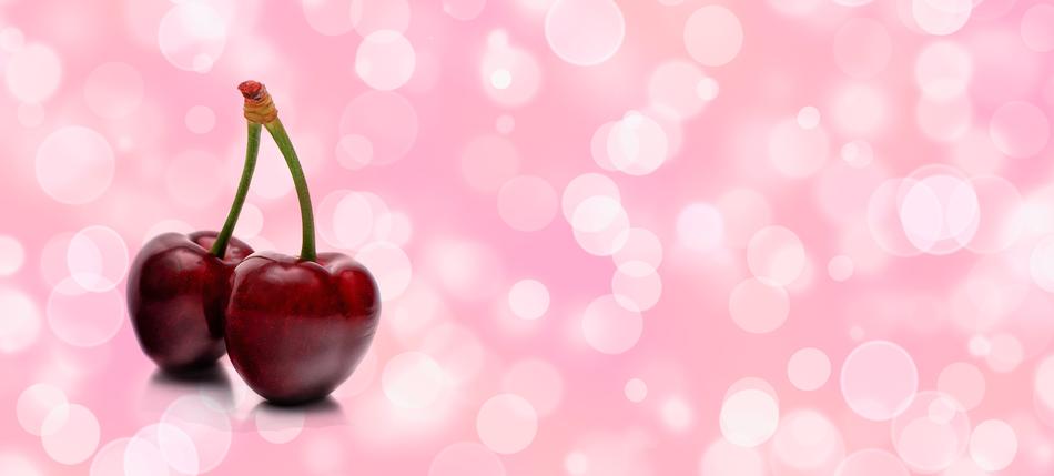 cherry on pink bokeh background