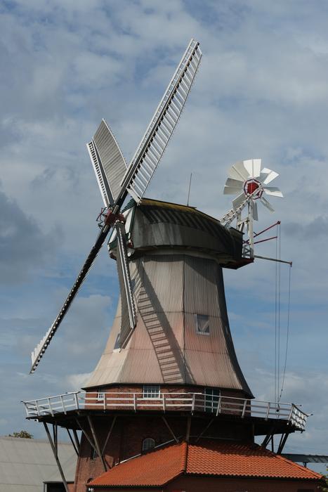 windmill against cloudy sky