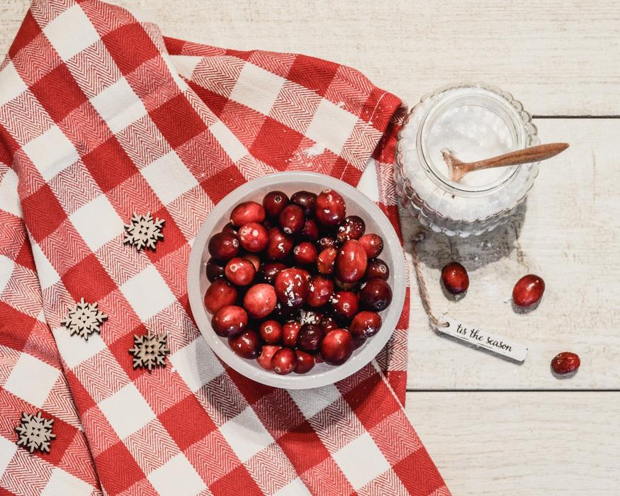 Cranberries with sugar on a colorful table