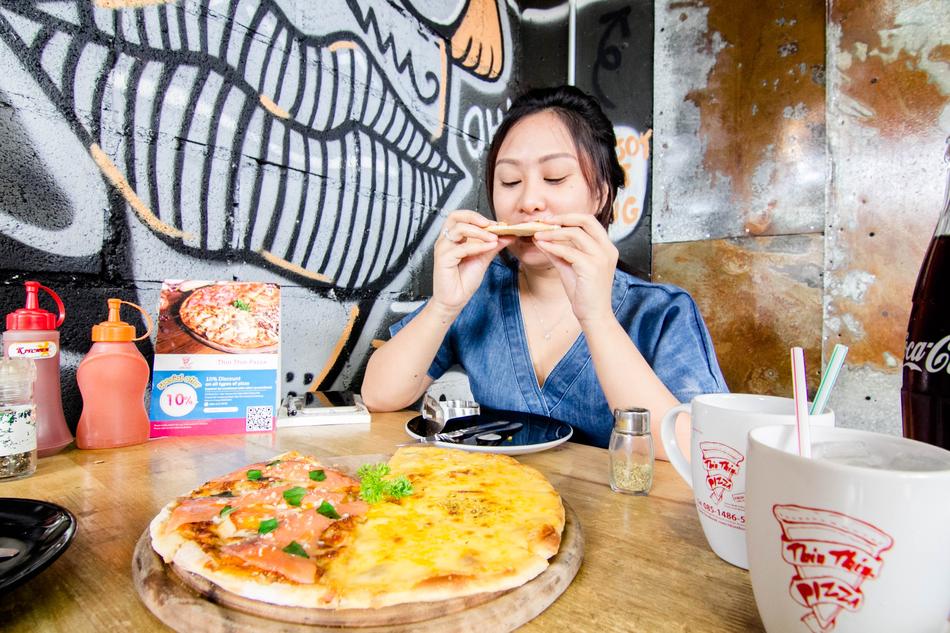 girl eating delicious pizza