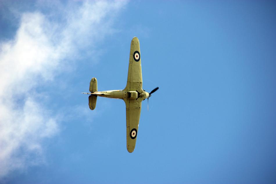 yellow airplane against blue