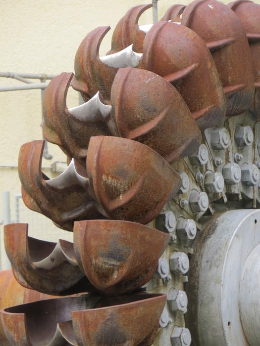 Close-up of the old, rusty, metal turbine near Walchensee, Germany