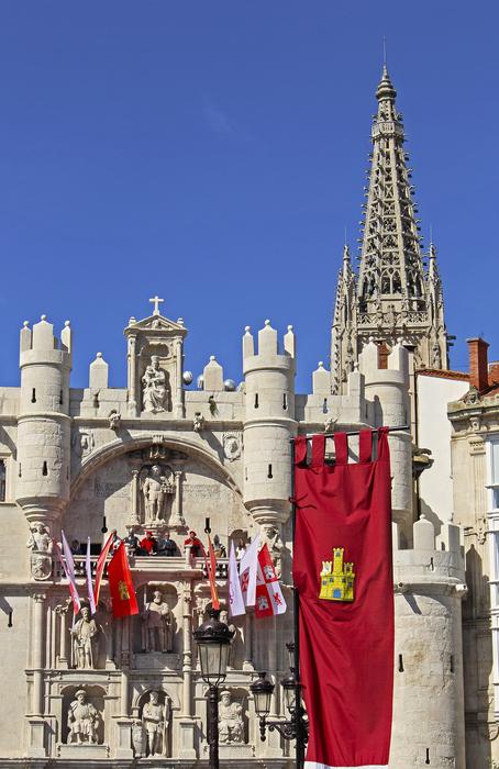a red flag on a castle in a blue sky
