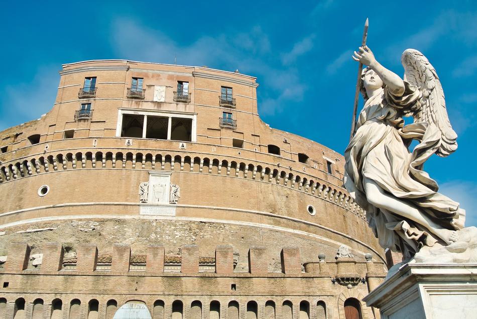large castle with an angel monument