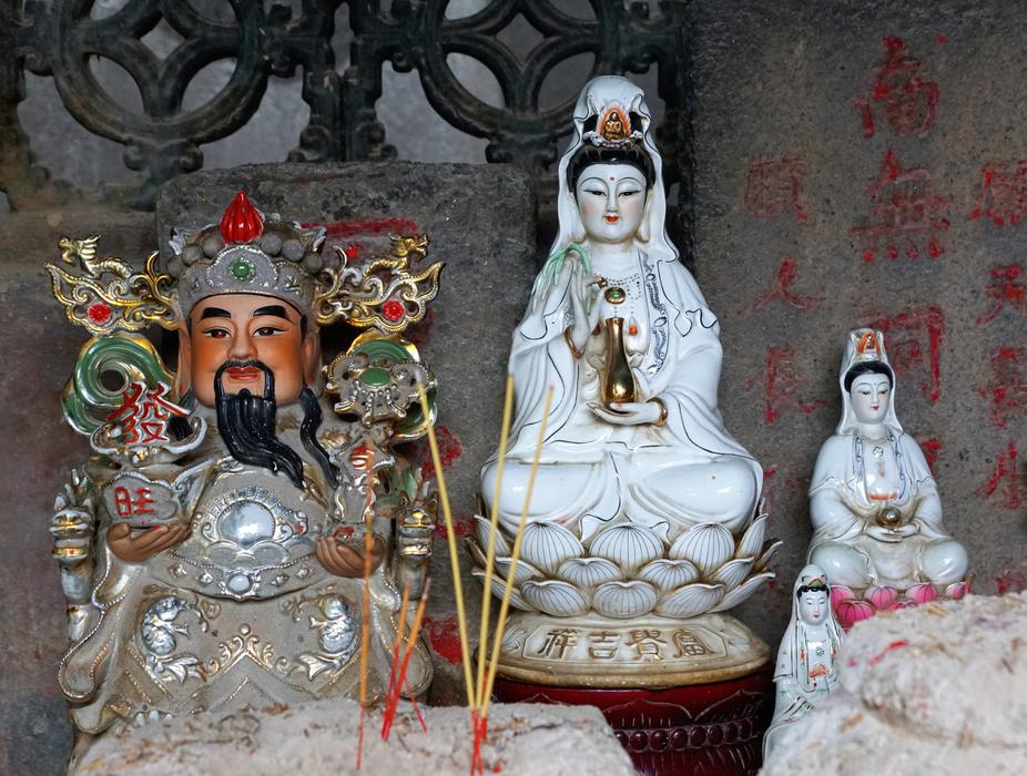 white figures with flowers and candles
