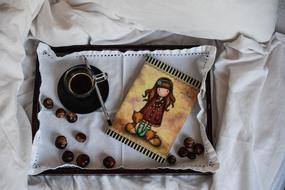 color notebook with hot coffee on the table
