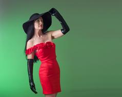 a girl in a red dress on a green background