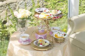 set table with sweets and flowers