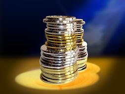 two shining stacks of Coins at blur background