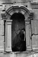 the girl in the black dress near the ruins