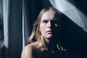 blonde girl in the shadows