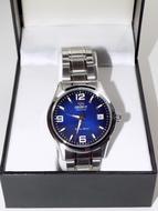 Beautiful, shiny, metallic men wrist watch, in the box, in light