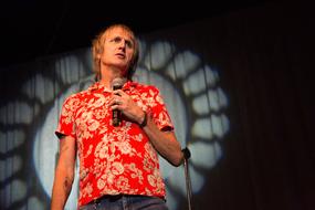 singer Performance red shirt