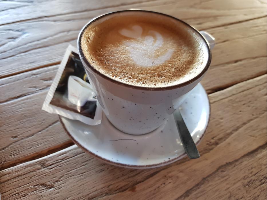 hot cappuccino on a wooden table
