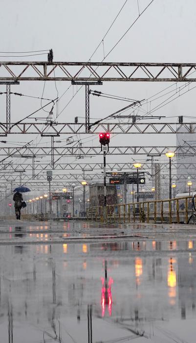 Woman With Umbrella Snowy Railway