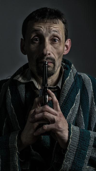 photo of old man with gun