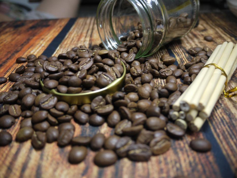 scattered coffee beans from a can