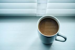 bitter coffee on the window sill