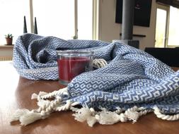 blue bedspread with white tassels