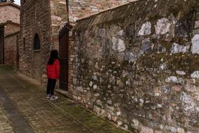 child at ancient stone town