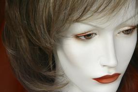 white mannequin with lipstick